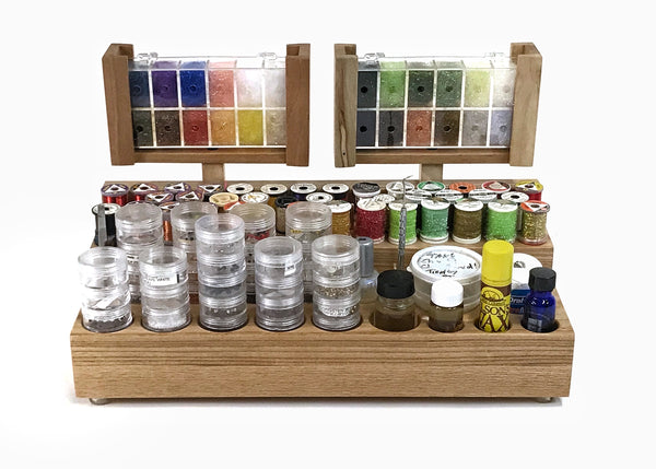 This is how I have my Side caddie loaded up. The preloaded dubbing dispenser containers always have the name of the dubbing on the opposite side of the dispensing hole. the holders on the Side Caddie rotate 360 degrees making it user friendly to locate the dubbing you are looking for. I am colorblind and really use the dubbing swivel a lot to locate the right dispensing hole and color.