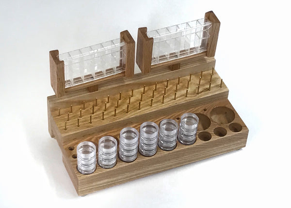 The Side Caddie comes with 41 brass spool pins to hold all the extra threads, wire and tinsels. It has some larger holes for the stackable container set that I sell in my accessories. lt is also for holding two of the dubbing dispenser containers. I also sell the empty dubbing dispenser containers in my accessories as well.