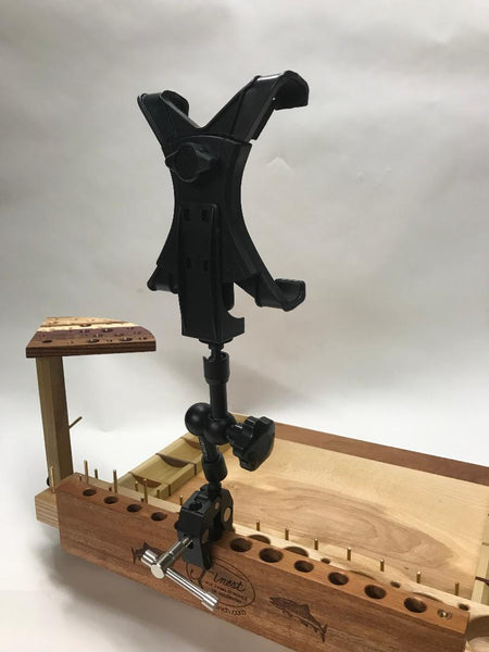 A clamp on A/V tool and tablet holder attached to a Broolie fly tying bench.