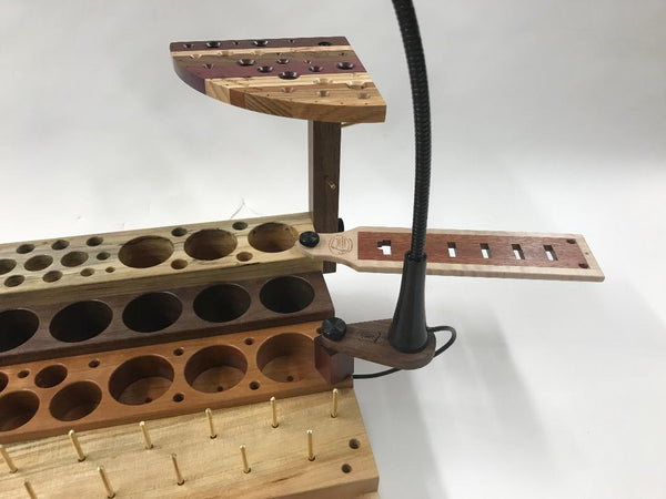 If you use the adjustable scissors, the plate can be modified to hold them nicely! The first slot on this plate is ready for a pair of adjustable scissors. On the outside end are three holes for a bodkin and two of your tools.