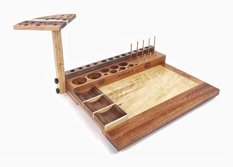 The Traveler fly tying bench is a great beginner bench. The fly tying bench in the photo is a left handed version. With the right side open, it makes pulling material into your hand easy.